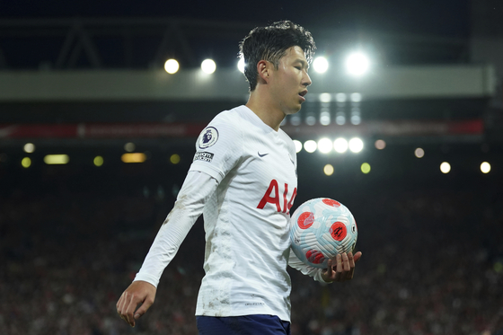 Tottenham's Son Heung-min walks to play a corner kick during the Premier League match between Liverpool and Tottenham Hotspur at Anfield stadium in Liverpool, England, on Saturday. [AP/YONHAP]