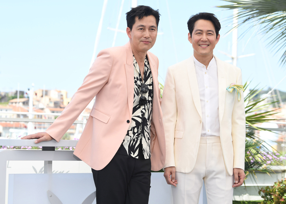 Actors Jung Woo-sung, left and Lee Jung-jae during a photo call at the 75th Cannes Film Festival in Cannes, southern France, on May 19. [AP]