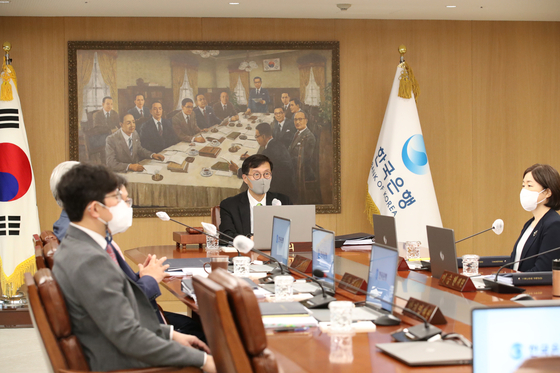 Bank of Korea Governor Rhee Chang-yong, center, at the monetary policy board meeting held in central Seoul on Thursday. [BOK]