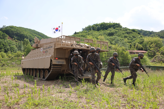 Korean Army soldiers dismount from a Redback at the end of the media event on Friday. [HANWHA DEFENSE]