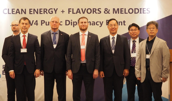 From front left, Gustav Slamecka, ambassador of the Czech Republic; Jan Kuderjavy, ambassador of the Slovak Republic; Mozes Csoma, ambassador of Hungary; and Min Won-ki, ambassador for science technology and innovation at Korea's Foreign Ministry, participate in the "Clean Energy plus Flavors and Melodies" public diplomacy event at the Lotte Hotel Seoul on Thursday organized by the embassies of the Visegrad Group in Korea. [EMBASSY OF HUNGARY IN KOREA]