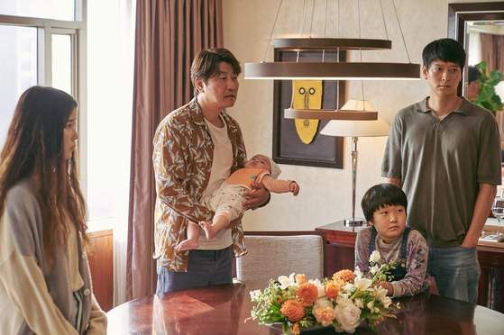 In “Broker” (2022), Song Kang-ho portrays Sang-hyun, a man who calls himself a broker of goodwill. Sang-hyun, Dong-soo (portrayed by Gang Dong-won) and a single mother named So-young (portrayed by Lee Ji-eun) embark on a journey to find a new home for So-young’s baby, Woo-sung. [CJ ENM]         