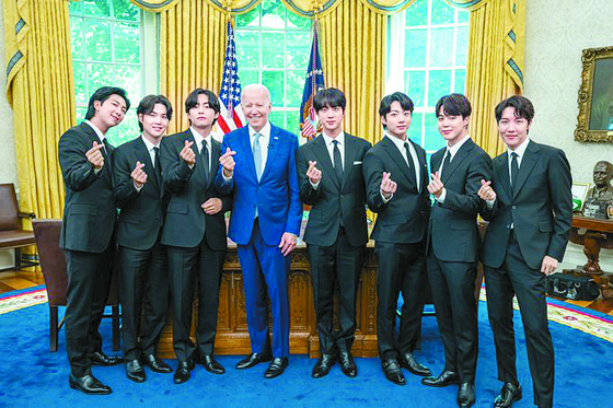 President Joe Biden of the United States and K-pop boy band BTS pose at the White House Oval Office after their meeting on May 31. [BIG HIT MUSIC] 