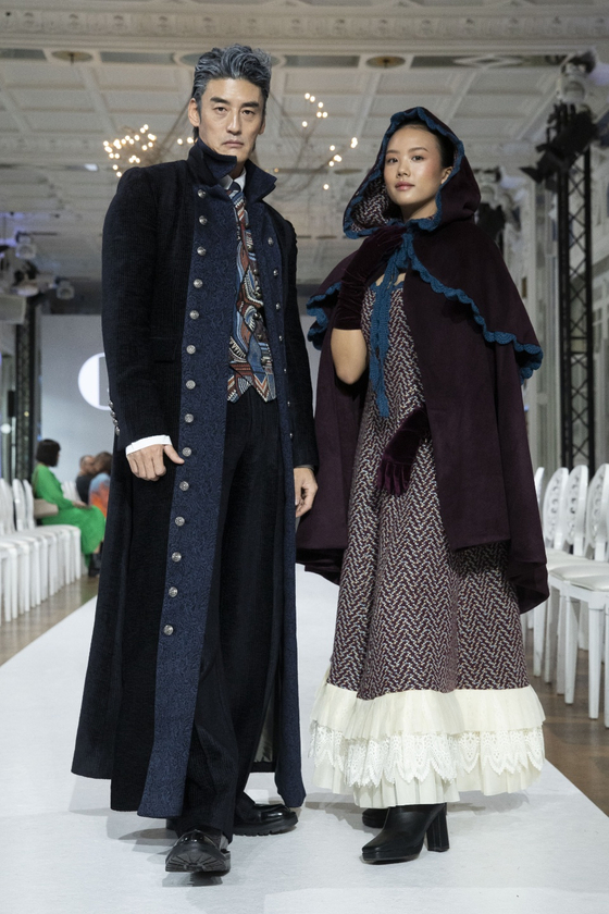 Models Jang Jae-heon, left, and Lee Jae-si donned BlueTamburin's fairy-tale-inspired looks for Paris Fashion Week F/W 2022. [BLUETAMBURIN]