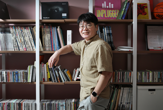 Music critic Kim Zakka poses for photos after an interview with the Korea JoongAng Daily at the 11018 office in Seongsu-dong, eastern Seoul. [PARK SANG-MOON]