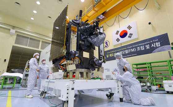 The Danuri is being examined by Korea Aerospace Research Institute (KARI) employees at the institute's satellite integration hall in Daejeon. [KARI]