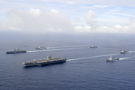 South Korean and U.S. aircraft and naval vessels move in formation during a combined military exercise in international waters off the Japanese island of Okinawa on Saturday. [YONHAP]