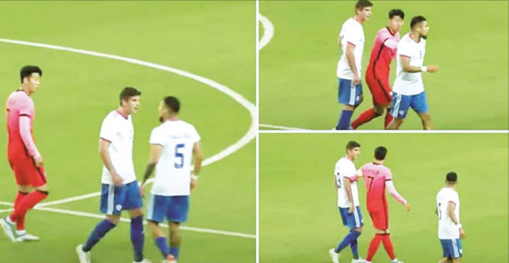 Son Heung-min, in red, breaks up a fi ght between Chile's Paulo Diaz and Benjamin Kuscevic during a game between Korea and Chile at Daejeon World Cup Stadium in Daejeon on Monday. [SCREEN CAPTURE]