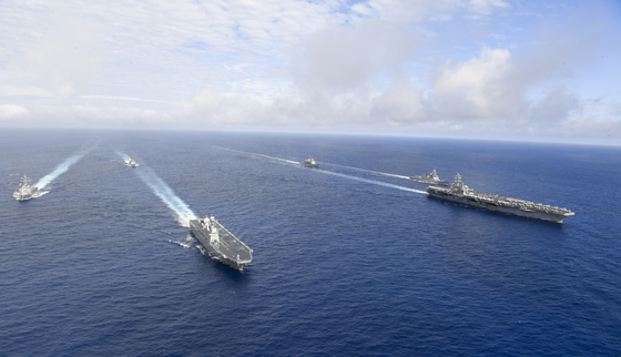 South Korea, the United States and Japan will conduct a combined missile detection and tracking exercise near Hawaii in August. The photograph depicts joint U.S.-South Korea naval drills that took place off Okinawa, Japan earlier this month. [JOINT CHIEFS OF STAFF] 