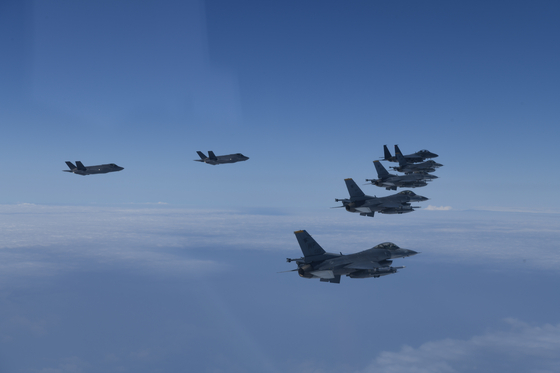 Fighter jets from the South Korean and U.S. militaries fly in formation during a joint air exercise over the Yellow Sea in a show of force on Tuesday. [JOINT CHIEFS OF STAFF]
