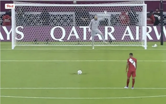 Australian goalkeeper Andrew Redmayne dances on the goal line to distract a penalty taker during the penalty shootout at the end of the AFC-CONMEBOL playoff for a spot in the 2022 Qatar World Cup in Qatar on Monday. [SCREEN CAPTURE]