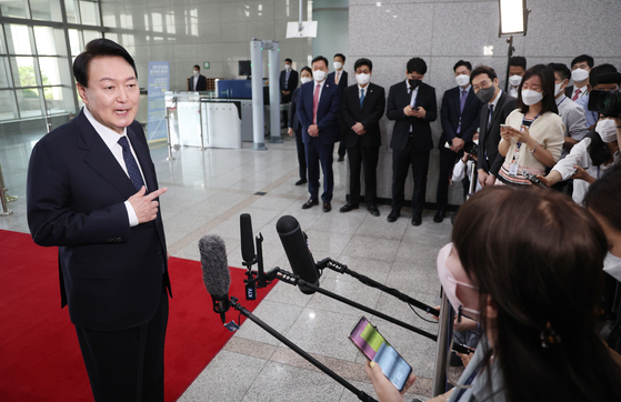 President Yoon Suk-yeol answers reporters’ questions about two North Korean fishermen repatriated in 2019 at the Yongsan Presidential Office in central Seoul Tuesday. [YONHAP]