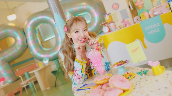 An image of Twice member Nayeon's ″POP!″ music video teaser, released on Wednesday [JYP ENTERTAINMENT]
