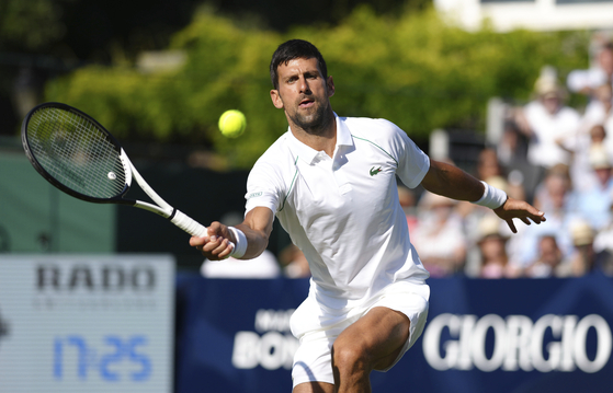 Serbia's Novak Djokovic during his ATP EXHO singles match against Felix Auger Aliassime on day two of the Giorgio Armani Tennis Classic at the Hurlingham Tennis Club in Brighton, England on Wednesday. [AP/YONHAP]