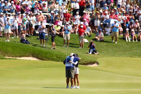 Chun In-gee celebrates with caddie Dean Herden after winning on the 18th green during the final round of the KPMG Women's PGA Championship at Congressional Country Club on Sunday in Bethesda, Maryland.  [AFP/YONHAP]