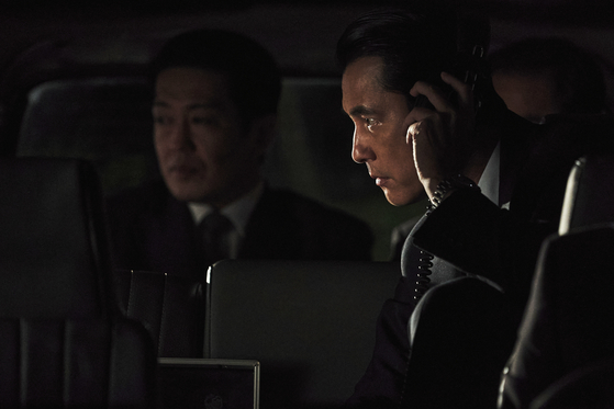 Top, Lee as Park Pyung-ho, the foreign unit chief of the Korean Central Intelligence Agency (KCIA), and Jung Woo-sung, above, as Kim Jung-do, the KCIA domestic unit chief, are both tasked with uncovering a North Korean spy within the organization in "Hunt." [MEGABOX PLUS M]