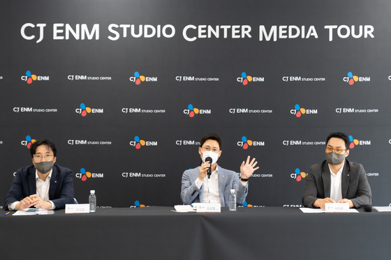 Executives from CJ ENM answer questions from the local press during a tour of the CJ ENM Studio Center taken place on Tuesday at Paju, Gyeonggi. From left are: Jun Sung-chul, public relations executive; Kim Sang-yeop, head of the Content R&D Center at CJ ENM; and Suh Jung-pil, general manager at the Media Tech & Art unit. [CJ ENM]