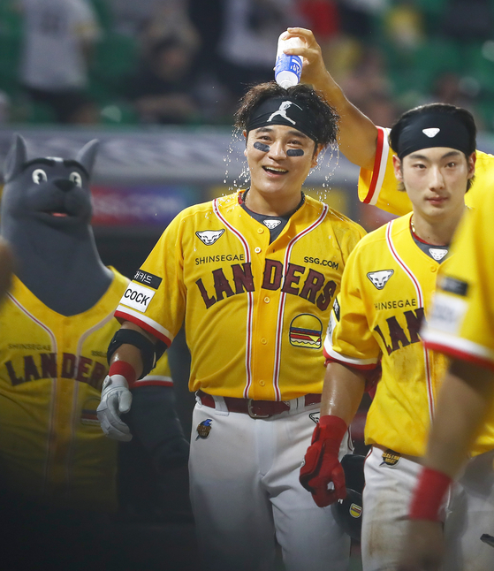 Choo Shin-soo of the SSG Landers celebrates with his teammates after hitting a walk-off home run in the bottom of the ninth inning in a game against the Lotte Giants at Incheon SSG Landers Field in Incheon on Tuesday. [YONHAP]