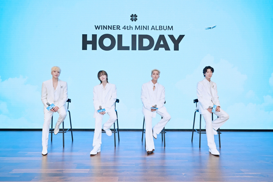 Winner poses during a press conference for its fourth EP ″Holiday″ held at the YG Entertainment building in western Seoul’s Hapjeong on July 5. [YG ENTERTAINMENT]