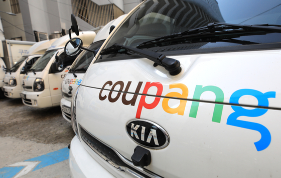 Coupang's delivery trucks are parked in a parking lot in Seoul. [NEWS1]