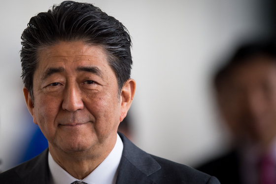 In this file photo taken on April 25, 2019 Japan's Prime Minister Shinzo Abe leaves the Bratislava Castle after a Visegrad group countries (V4) and Japan meeting in Bratislava. - Abe has been confirmed dead after he was shot at a campaign event in the city of Nara on Friday, public broadcaster NHK and Jiji news agency reported. [AFP/YONHAP]