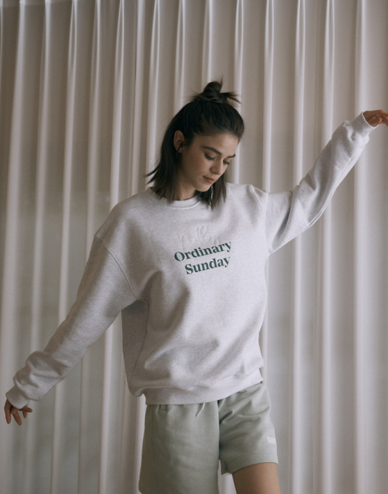 A model wears a crew neck sweatshirt from NOS7 [NOS7]