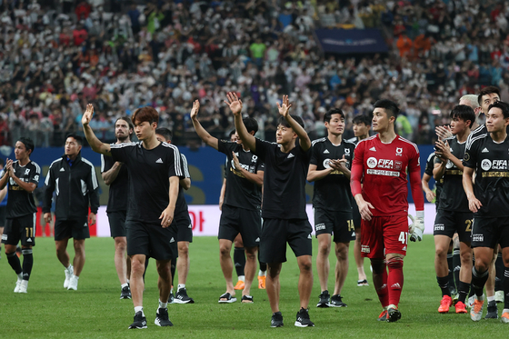 Team K League leave the pitch at the end of a game against Tottenham Hotspur at Seoul World Cup Stadium in western Seoul on Wednesday. [YONHAP]