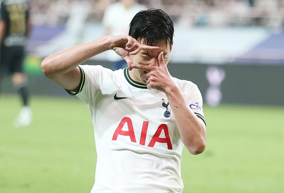 Son Heung-min celebrates after scoring Tottenham Hotspur's sixth goal in a game against Team K League at Seoul World Cup Stadium in western Seoul on Wednesday. [YONHAP]