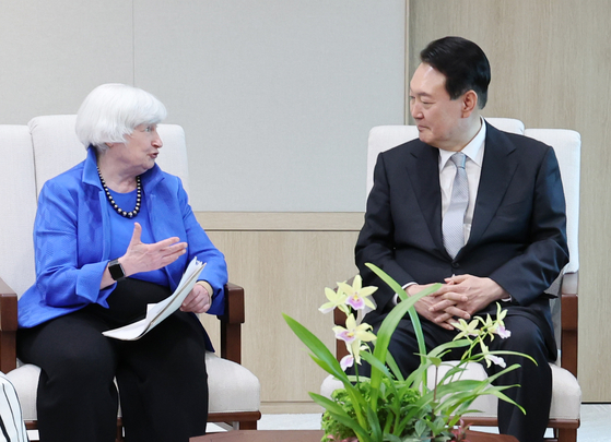 U.S. Treasury Secretary Janet Yellen, left, speaks to President Yoon Suk-yeol at the presidential office in Yongsan, central Seoul, on Tuesday. [YONHAP]