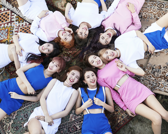 Album cover of EP "TWICEcoaster : LANE 1" showcasing nine members of girl group Twice [JYP ENTERTAINMENT]