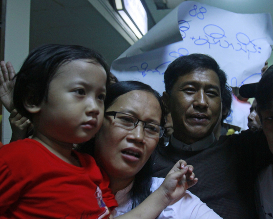 In this file photo, Myanmar democracy activist Kyaw Min Yu, right, is welcomed by his wife Nilar Thein and their daughter at the domestic airport in Yangon, Myanmar, on Jan. 13, 2012. Kyaw Min Yu was among four activists executed in Myanmar, its military junta announced Monday. [EPA/YONHAP] 