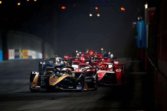 Formula E cars race at Riyadh Street Circuit in Riyadh, Saudi Arabia on Jan. 29.  [LAT IMAGES]