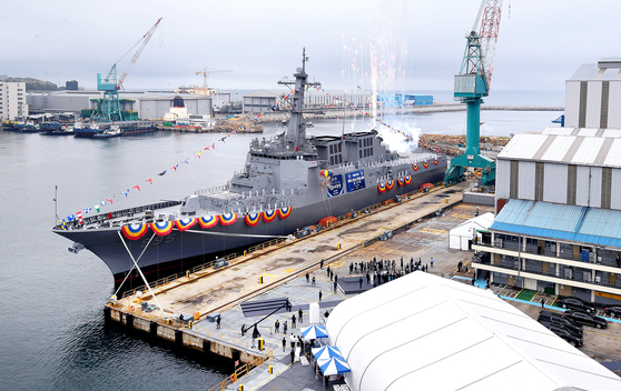 Cannons are fired during a launching ceremony for the Korean Navy’s 8,200-ton Aegis destroyer, King Jeongjo the Great, at the Hyundai Heavy Industries shipyard in Ulsan Thursday. [JOINT PRESS CORPS]