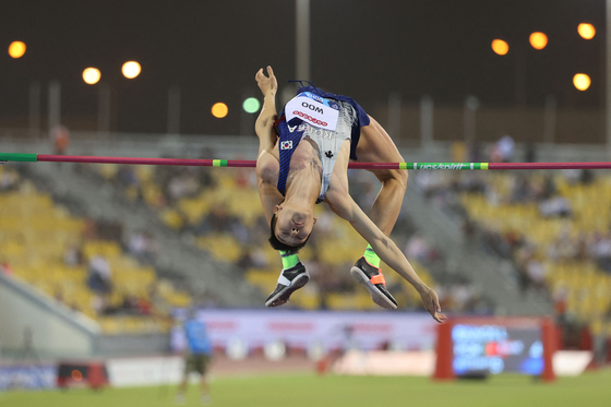 Woo Sang-hyeok competes during the men's high jump event during the Diamond League athletics Doha meeting at the Khalifa International stadium in Doha on May 13. [AFP/YONHAP]