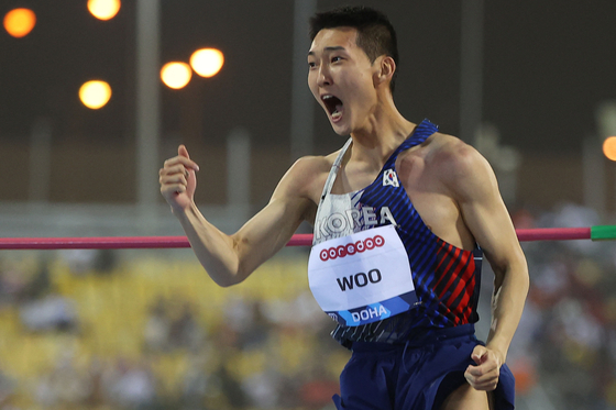 Woo Sang-hyeok celebrates during the men's high jump event during the Diamond League athletics Doha meeting at the Khalifa International stadium in Doha on May 13. [AFP/YONHAP]