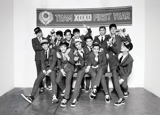 Exo in 2013. Min was the art director behind the boy band's popular school uniform look. [SM ENTERTAINMENT]