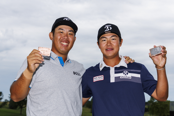 An Byeong-hun, left and Kim Seong-hyeon pose for a photo after the final round of the Korn Ferry Tour’s Pinnacle Bank Championship presented by Aetna at The Club at Indian Creek on Sunday in Omaha, Nebraska. [PGA TOUR]