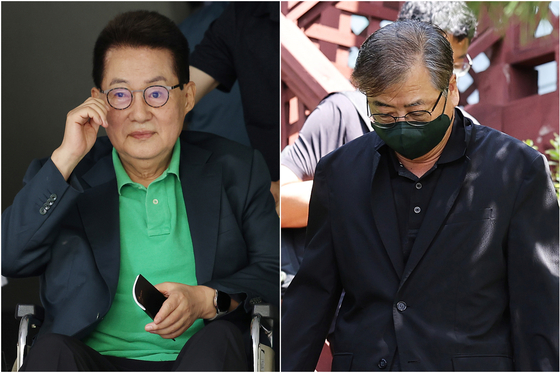 Former National Intelligence Service directors Park Jie-won, left, and Suh Hoon emerge from their homes after they were raided by prosecutors on Tuesday. [YONHAP]