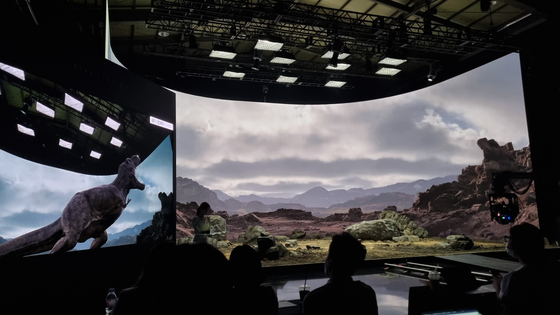 A dinosaur is shown on the screen during a press tour of Vive Studio's virtual production studio in Gonjiam, Gyeonggi, on Friday. [YOON SO-YEON]