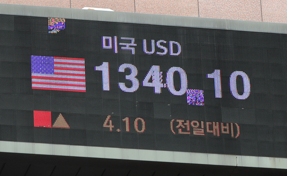 Won trades above 1,340 to the dollar on Monday, the first in 13 years and four months. An electronic display outside Hana Bank in central Seoul shows won against dollar on the same day. [NEWS1]