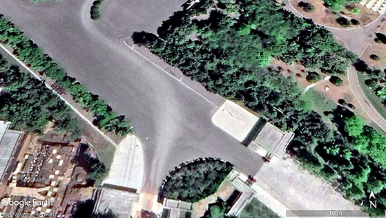 Vehicle tracks on a road in front of the security complex inside a Pyongyang compound for the regime's leadership can be seen in these Google Earth images from May 2022, which were analyzed by 38 North. [GOOGLE EARTH]