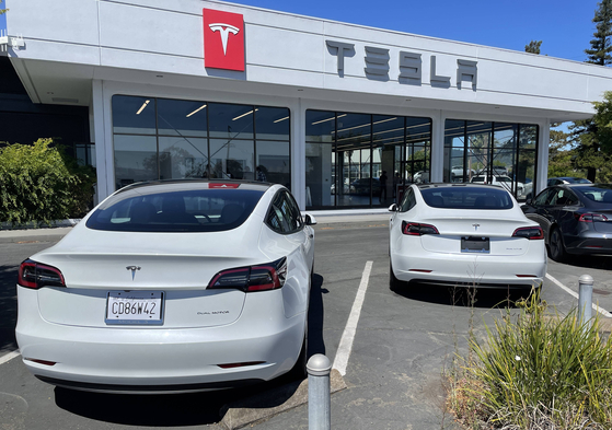 Brand new Tesla cars sit in a parking lot at a Tesla showroom on June 27, 2022 in Corte Madera, California. [AFP]