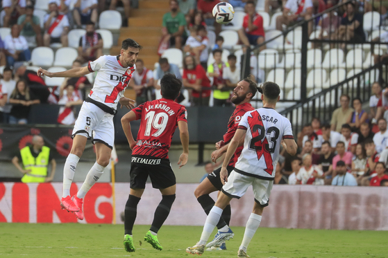 Rayo Vallecano's defender Alejandro Catena, left, in action against Mallorca's Lee Kang-in, second from left, during the match against Rayo Vallecano held at Vallecas stadium in Madrid, Spain on Saturday. [EPA/YONHAP]