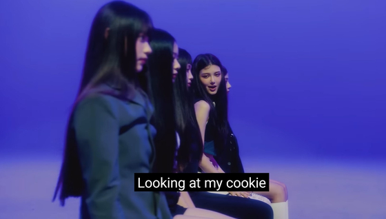 NewJeans's song “Cookie” is facing the most backlash for lyrics that can be interpreted as sexual innuendo, while the underage members appear in schoolgirl-inspired outfits. [SCREEN CAPTURE]