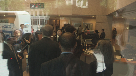 Representatives of the Korean government and Lone Star Funds wait to pass through security at the International Centre for Settlement of Investment Disputes in Washington in May 2015. [YONHAP]