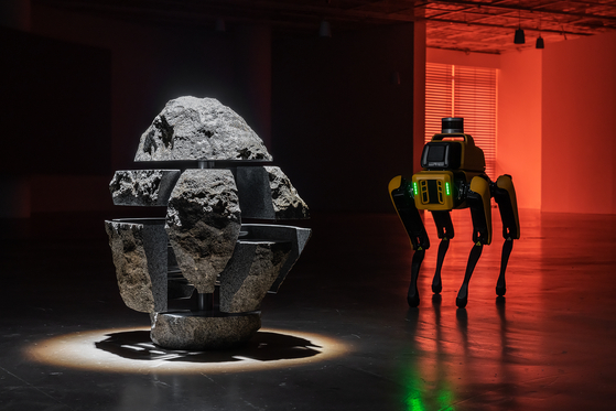 The rock, left, and Spot the robot from ″To Build a Fire″ (2022) [ART SONJE CENTER]