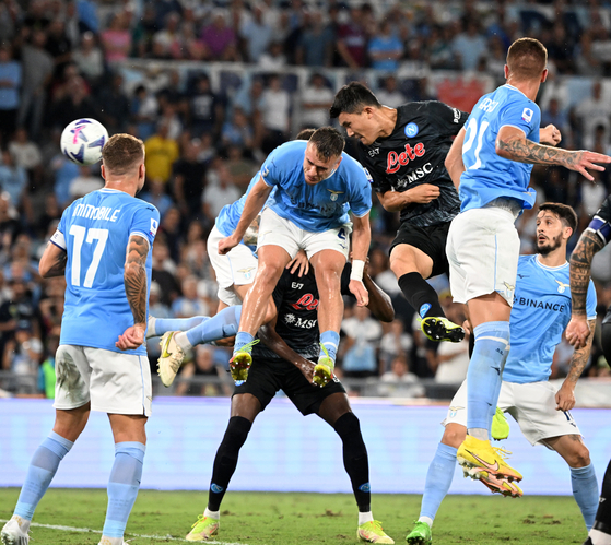 Kim Min-jae heads in Napoli's opening goal during a Serie A clash with Lazio in Rome on Saturday. [XINHUA/YONHAP]