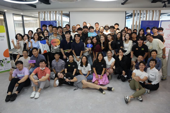 Marta Allina, bottom center, poses with participants at the Busan Startup Weekend Big Data for Good hackathon. [MARTA ALLINA]