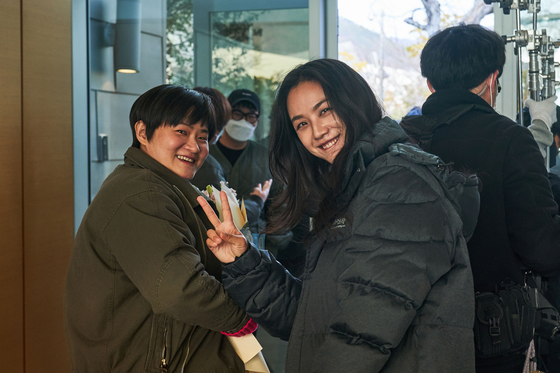 Kim, left, and actor Tang Wei on the set of the film ″Decision to Leave″ [CJ ENM]            