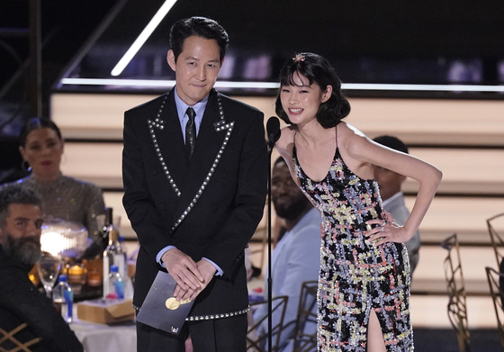 Lee Jung-jae, left, and and Jung Ho-yeon present the Emmy for Outstanding Variety Sketch Series at the 74th Primetime Emmy Awards on Monday at the Microsoft Theater in Los Angeles. [AP/YONHAP]